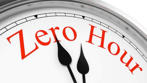 A clock with the hands pointing to words that say Zero Hour